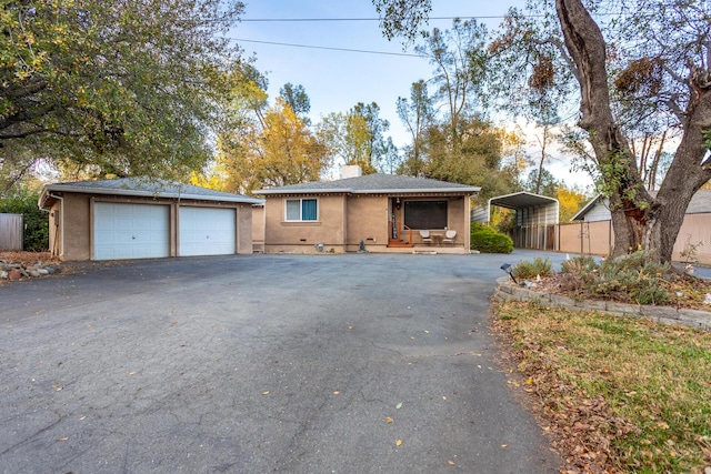 3274 Quartz Hill Rd, Redding, CA 96003 - view of front of home featuring an outbuilding, a carport, a garage, stucco siding, and a chimney