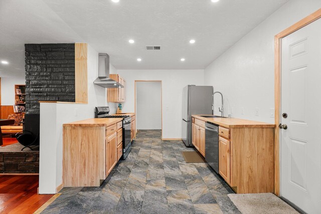 3371 Bardick Rd, Anderson, CA 96007 - kitchen featuring range hood, stainless steel appliances, wooden counters, light brown cabinets, and recessed lighting