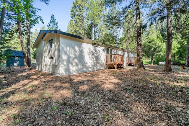 7727 Pegnan Rd, Shingletown, CA 96088 - view of property exterior with a wooden deck