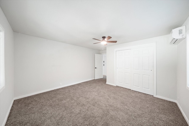 1949 Montana Ave, Shasta Lake, CA 96019 - unfurnished bedroom with a wall mounted air conditioner, carpet floors, and baseboards