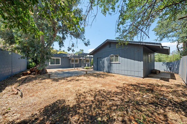 1949 Montana Ave, Shasta Lake, CA 96019 - back of property featuring a fenced backyard and a patio
