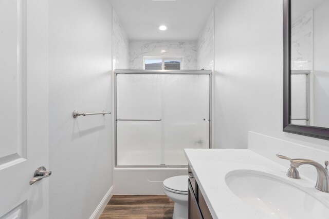 4537 Risstay Way, Shasta Lake, CA 96019 - full bathroom with vanity, bath / shower combo with glass door, wood finished floors, and recessed lighting