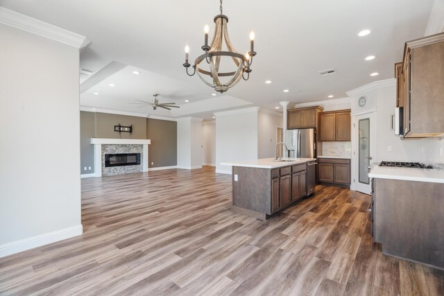 4537 Risstay Way, Shasta Lake, CA 96019 - kitchen featuring appliances with stainless steel finishes, ceiling fan, ornamental molding, light countertops, and a chandelier