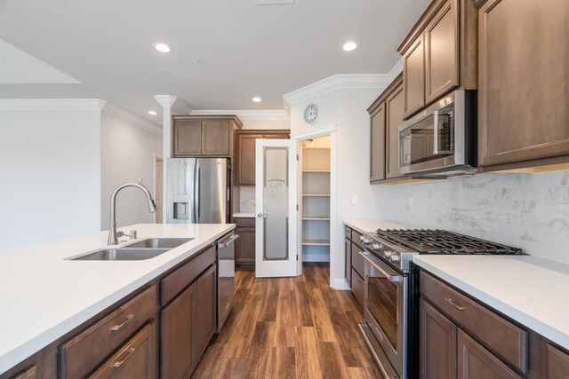 4537 Risstay Way, Shasta Lake, CA 96019 - kitchen with stainless steel appliances, ornamental molding, dark wood-type flooring, recessed lighting, and light countertops