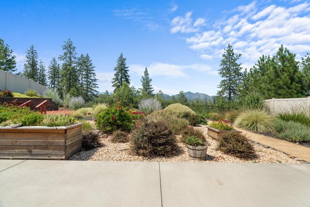 4537 Risstay Way, Shasta Lake, CA 96019 - view of yard featuring a mountain view, a patio area, and a garden