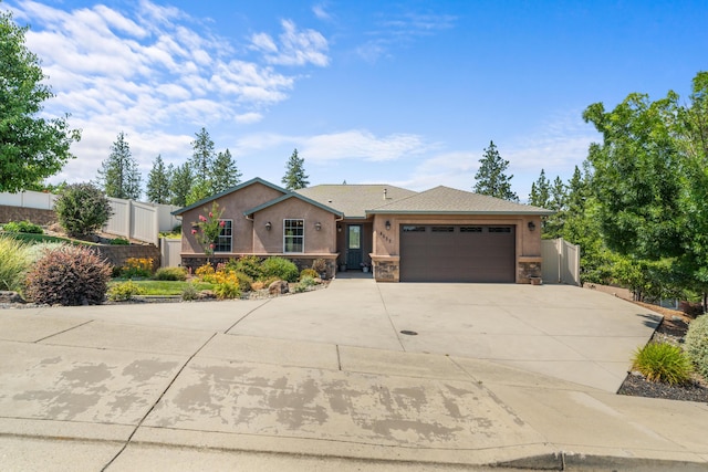 4537 Risstay Way, Shasta Lake, CA 96019 - ranch-style house featuring a garage, driveway, stone siding, and stucco siding