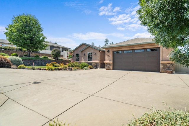 4537 Risstay Way, Shasta Lake, CA 96019 - ranch-style house with stone siding, stucco siding, driveway, and a garage