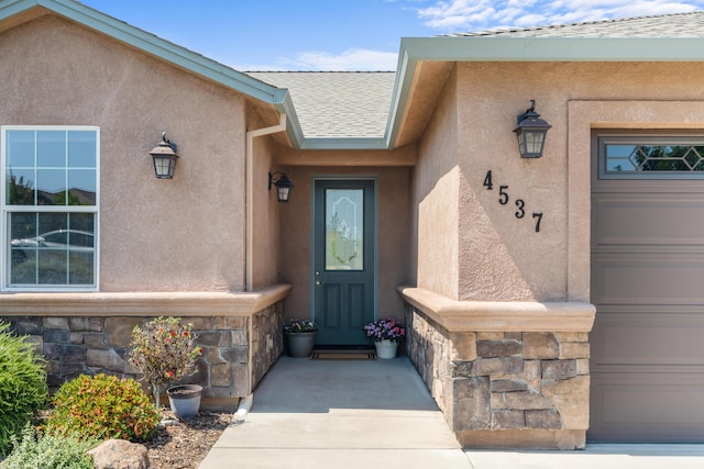 4537 Risstay Way, Shasta Lake, CA 96019 - property entrance with stone siding, stucco siding, and a shingled roof