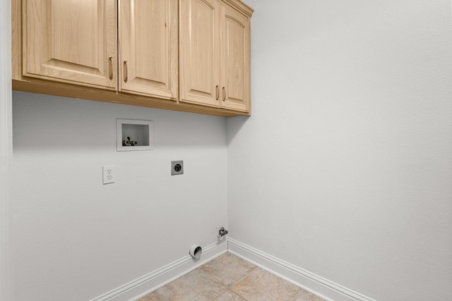 4230 Brittany Dr, Redding, CA 96002 - laundry room featuring cabinet space, hookup for a washing machine, and hookup for an electric dryer