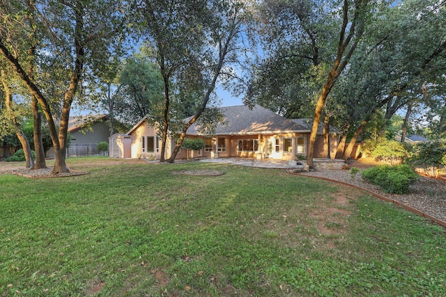 4230 Brittany Dr, Redding, CA 96002 - back of house featuring stucco siding and a patio