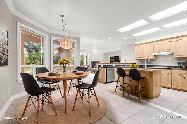 4230 Brittany Dr, Redding, CA 96002 - dining room with ornamental molding, recessed lighting, a skylight, light tile patterned floors, and a chandelier