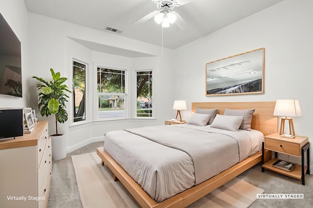 4230 Brittany Dr, Redding, CA 96002 - bedroom featuring light carpet and a ceiling fan