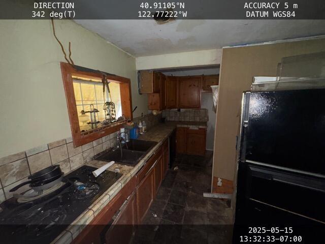 200 Millview Dr, Trinity Center, CA 96091 - kitchen with backsplash and brown cabinets