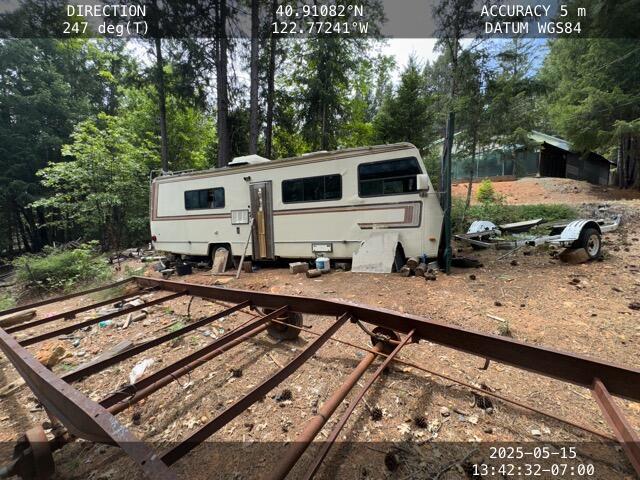 200 Millview Dr, Trinity Center, CA 96091 - view of outdoor structure with a vegetable garden and view of wooded area