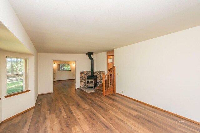 131 Northwoods Ests, Trinity Center, CA 96091 - unfurnished living room with wood finished floors and a wood stove