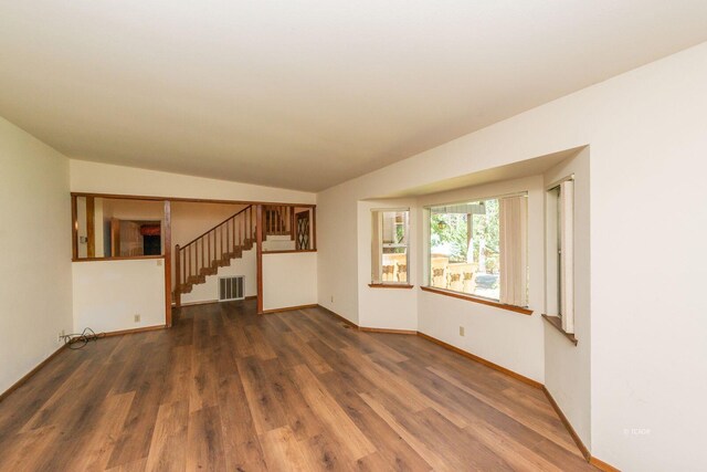 131 Northwoods Ests, Trinity Center, CA 96091 - unfurnished living room featuring wood finished floors, stairway, and lofted ceiling
