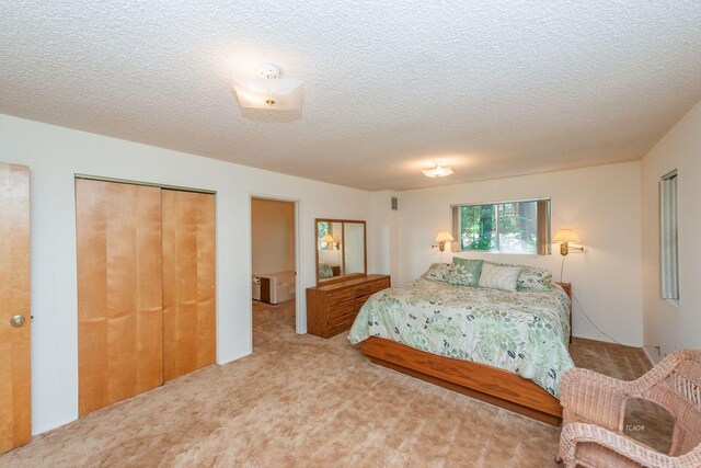 131 Northwoods Ests, Trinity Center, CA 96091 - carpeted bedroom featuring a closet and a textured ceiling