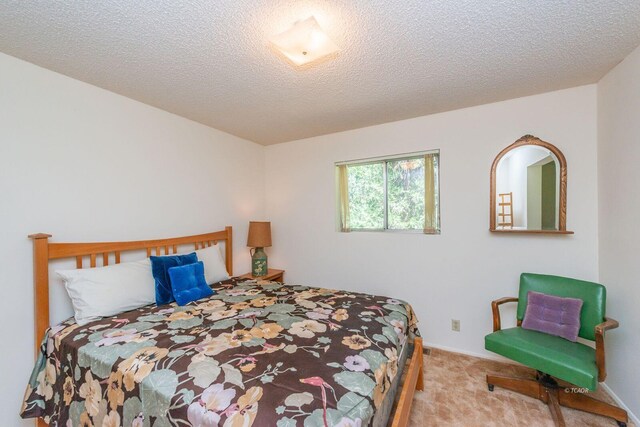 131 Northwoods Ests, Trinity Center, CA 96091 - bedroom featuring carpet flooring and a textured ceiling