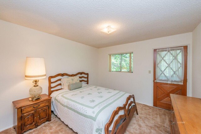 131 Northwoods Ests, Trinity Center, CA 96091 - bedroom with light carpet and a textured ceiling
