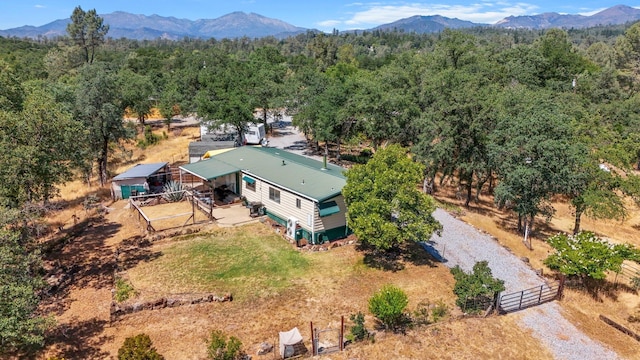12051 Norma Ln, Redding, CA 96003 - view of subject property featuring a mountainous background and a forest