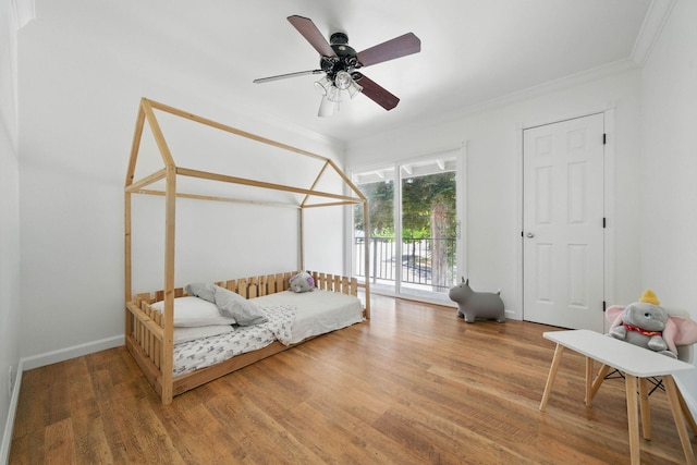 4050 Oro Ct, Redding, CA 96001 - bedroom with ornamental molding, wood finished floors, access to outside, and a ceiling fan