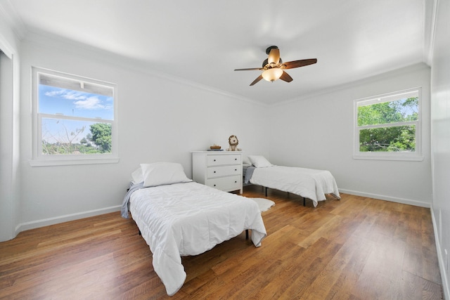 4050 Oro Ct, Redding, CA 96001 - bedroom featuring crown molding, wood finished floors, and a ceiling fan