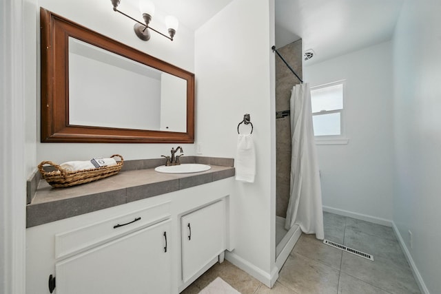 4050 Oro Ct, Redding, CA 96001 - full bathroom featuring vanity, a stall shower, and tile patterned floors