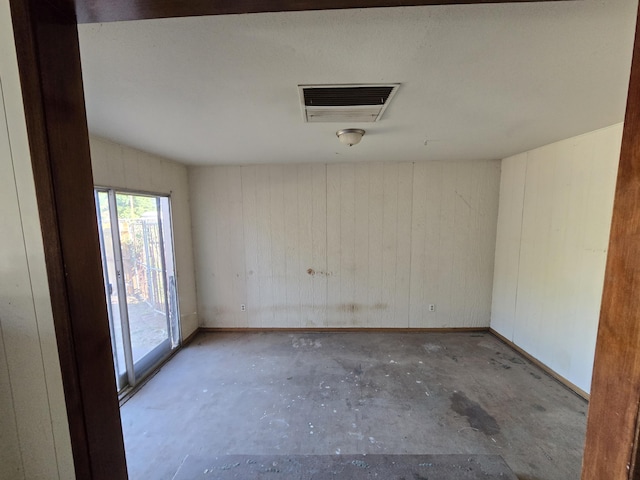 1927 Lindeena Ln, Redding, CA 96002 - unfurnished room featuring unfinished concrete flooring and wooden walls