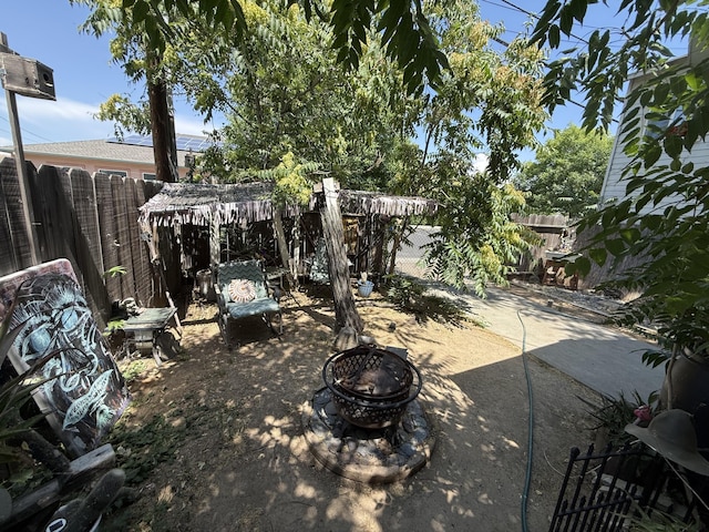 728 Lincoln St, Red Bluff, CA 96080 - fenced backyard with a fire pit and a patio