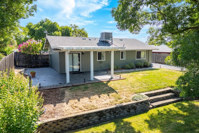 830 Redwood Blvd, Redding, CA 96003 - rear view of property featuring a patio, a fenced backyard, board and batten siding, and roof with shingles