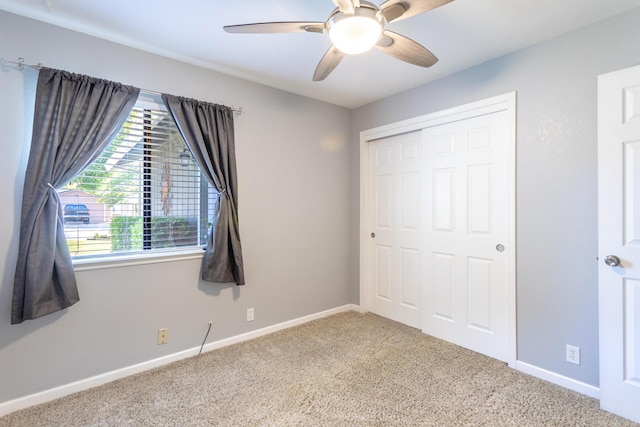 830 Redwood Blvd, Redding, CA 96003 - unfurnished bedroom with carpet, a closet, and a ceiling fan
