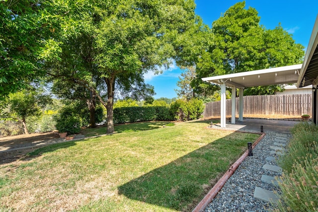 830 Redwood Blvd, Redding, CA 96003 - fenced backyard with a patio area