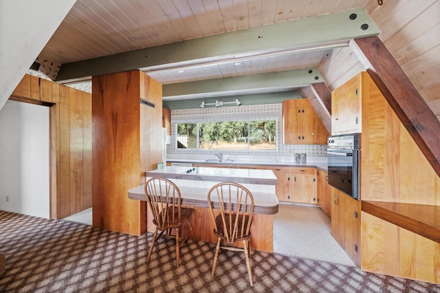 10268 Deschutes Rd, Palo Cedro, CA 96073 - kitchen featuring oven, light carpet, a wooden ceiling with exposed beams, backsplash, and a peninsula