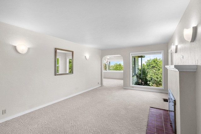 2040 Sonoma St, Redding, CA 96001 - unfurnished living room featuring carpet and arched walkways