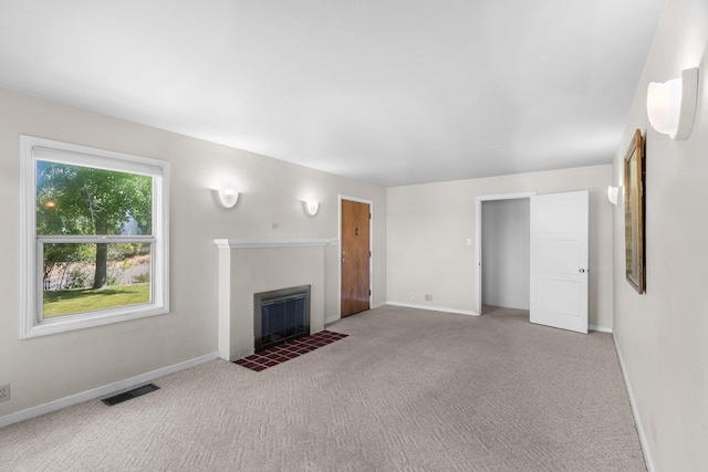 2040 Sonoma St, Redding, CA 96001 - unfurnished living room featuring a fireplace with flush hearth and carpet floors