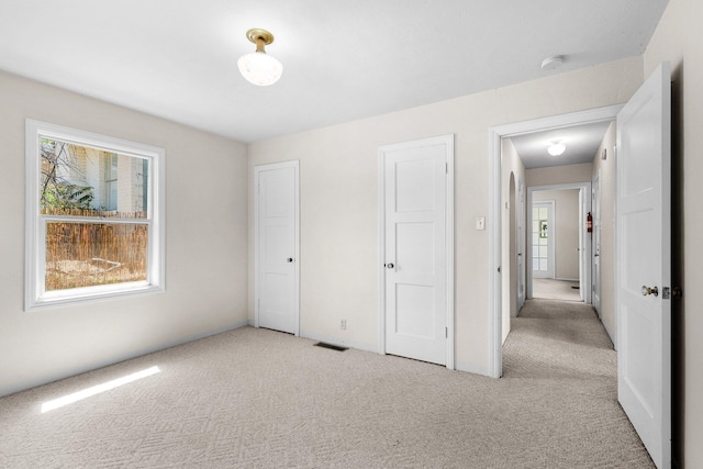 2040 Sonoma St, Redding, CA 96001 - unfurnished bedroom featuring carpet floors and multiple windows