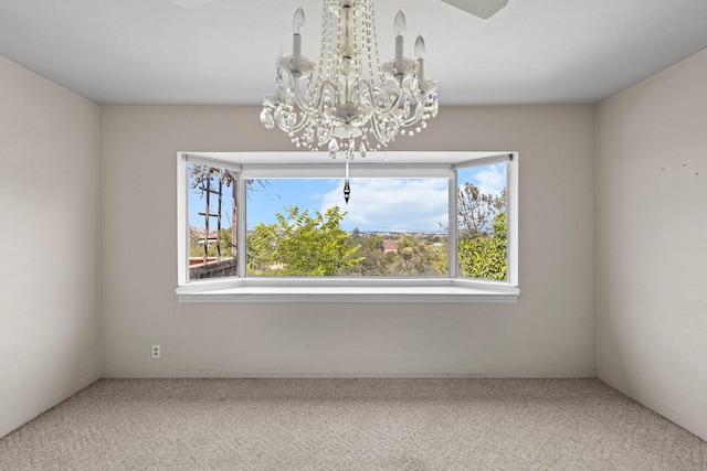 2040 Sonoma St, Redding, CA 96001 - carpeted empty room with plenty of natural light and a chandelier