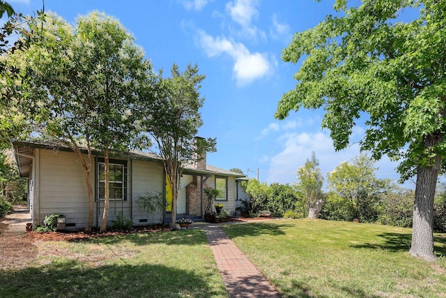 2040 Sonoma St, Redding, CA 96001 - view of front of house featuring a front yard, a chimney, and crawl space