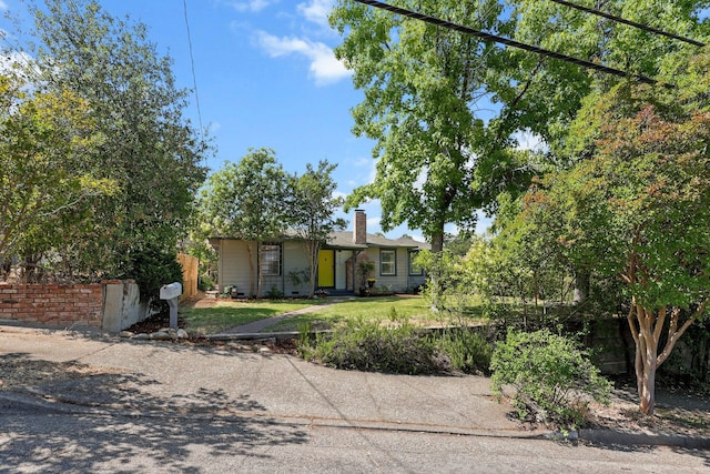 2040 Sonoma St, Redding, CA 96001 - view of front of property featuring a chimney and a front yard