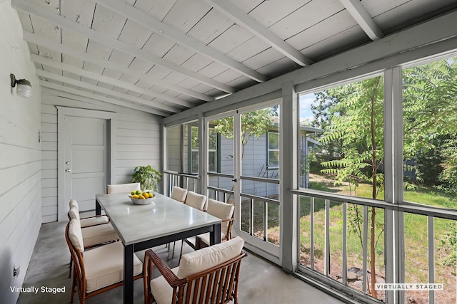 2040 Sonoma St, Redding, CA 96001 - sunroom featuring concrete flooring, outdoor dining area, wood ceiling, and wood walls