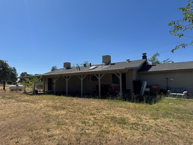 2580 Old Alturas Rd, Redding, CA 96003 - rear view of property with a lawn and a chimney