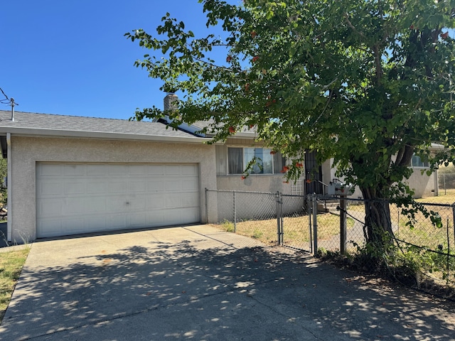 2580 Old Alturas Rd, Redding, CA 96003 - view of front of house featuring driveway, an attached garage, stucco siding, and a chimney