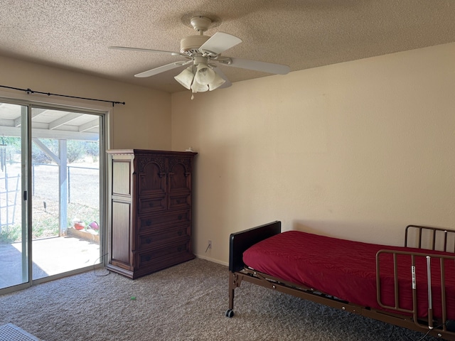 2580 Old Alturas Rd, Redding, CA 96003 - carpeted bedroom with access to exterior, a textured ceiling, and ceiling fan