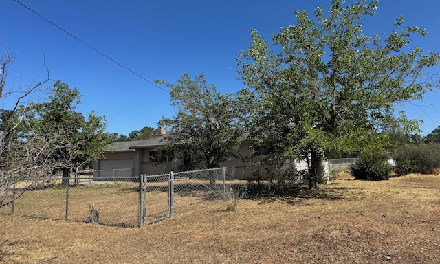 2580 Old Alturas Rd, Redding, CA 96003 - fenced yard featuring a gate and an attached garage