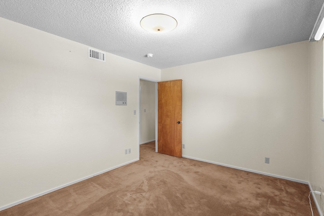 910 Hallmark Dr, Redding, CA 96001 - carpeted spare room featuring baseboards and a textured ceiling