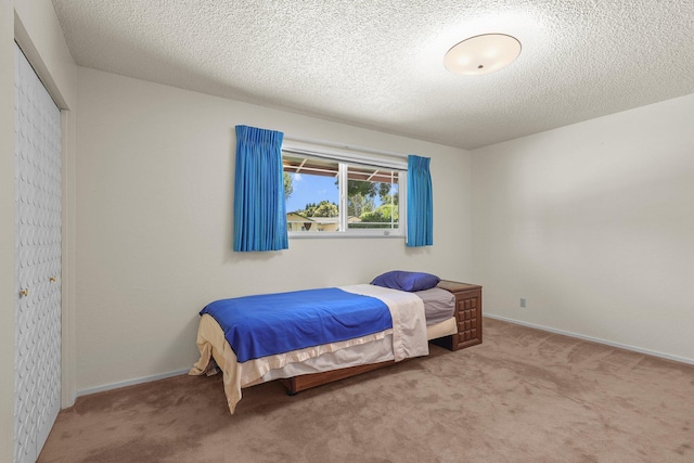910 Hallmark Dr, Redding, CA 96001 - carpeted bedroom with baseboards and a textured ceiling