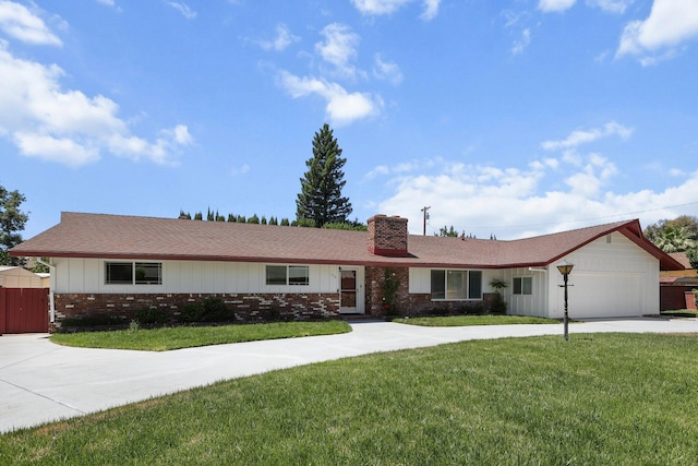 910 Hallmark Dr, Redding, CA 96001 - ranch-style house with concrete driveway, brick siding, a chimney, a garage, and roof with shingles