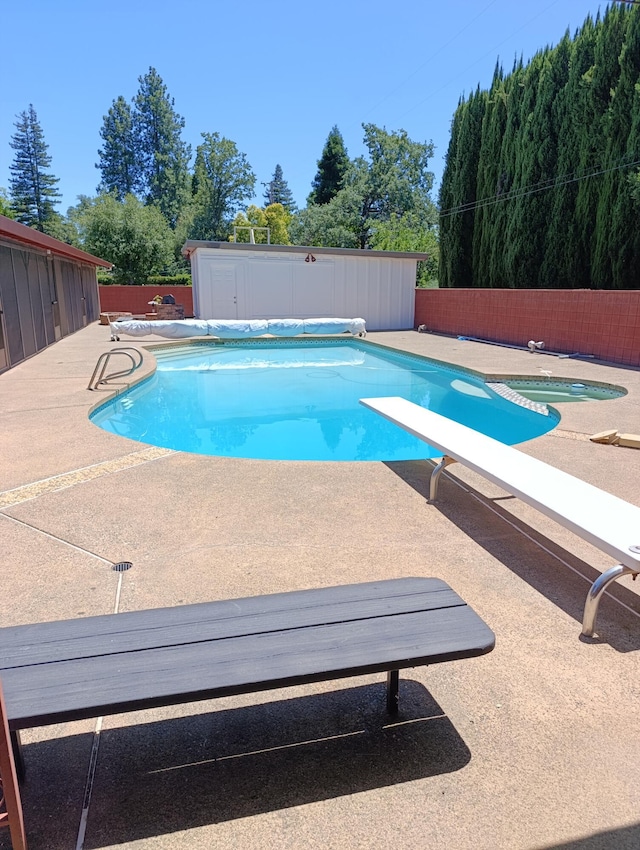 910 Hallmark Dr, Redding, CA 96001 - view of pool with a patio, a fenced backyard, and a diving board