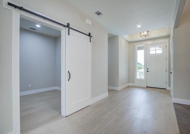 19450 Vista Del Monte Ct, Redding, CA 96003 - entryway with a barn door, light wood-style floors, and recessed lighting
