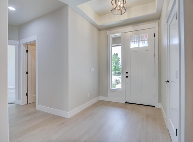 19450 Vista Del Monte Ct, Redding, CA 96003 - entryway featuring light wood finished floors, a chandelier, and plenty of natural light